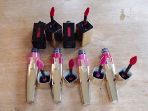 Top: YSL Glossy Stain in 13 Rose Tempura and 11 Rouge Gouache Bottom: L'Oreal Caresse Aqua Lacquer in Rose On and On, Infinite Fuchsia, Pink Rebellion and Endless Red